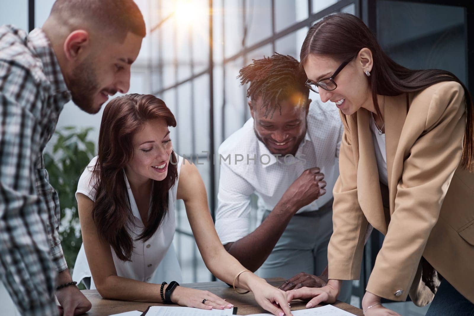 Ambitious smart employee speaks in a meeting and shares her opinion on a creative idea in a group briefing