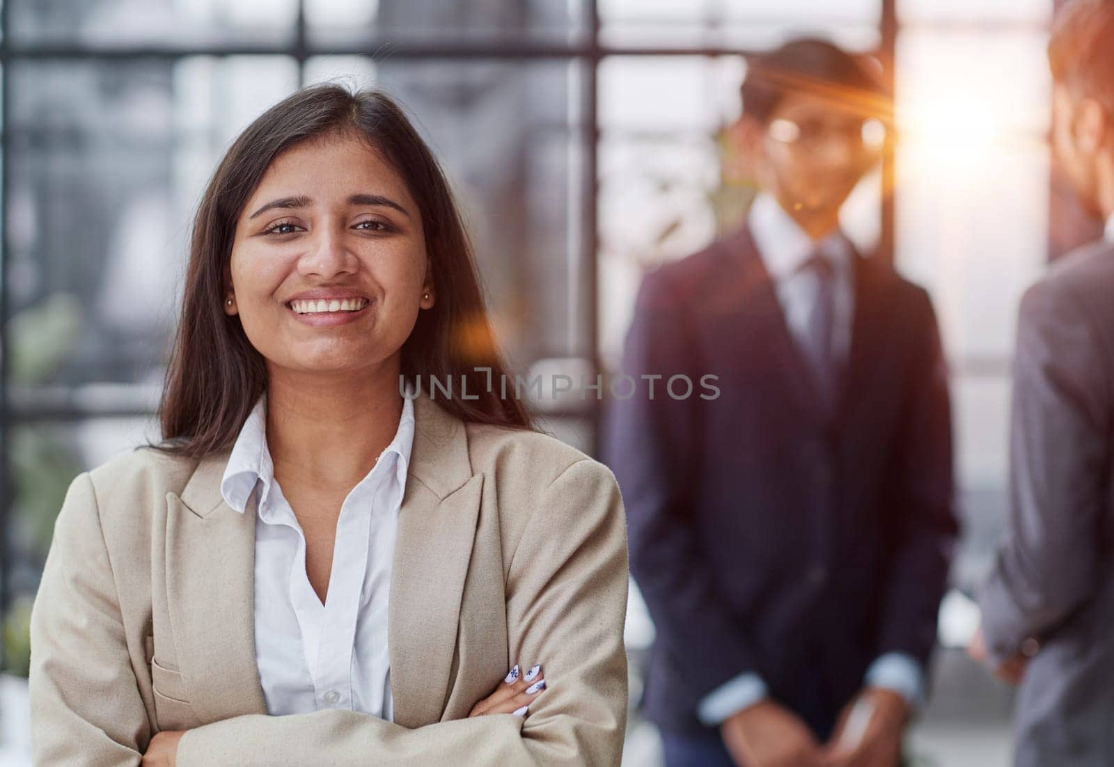 Group managers or employees standing in modern office hall after staff briefing and discussing corporate news