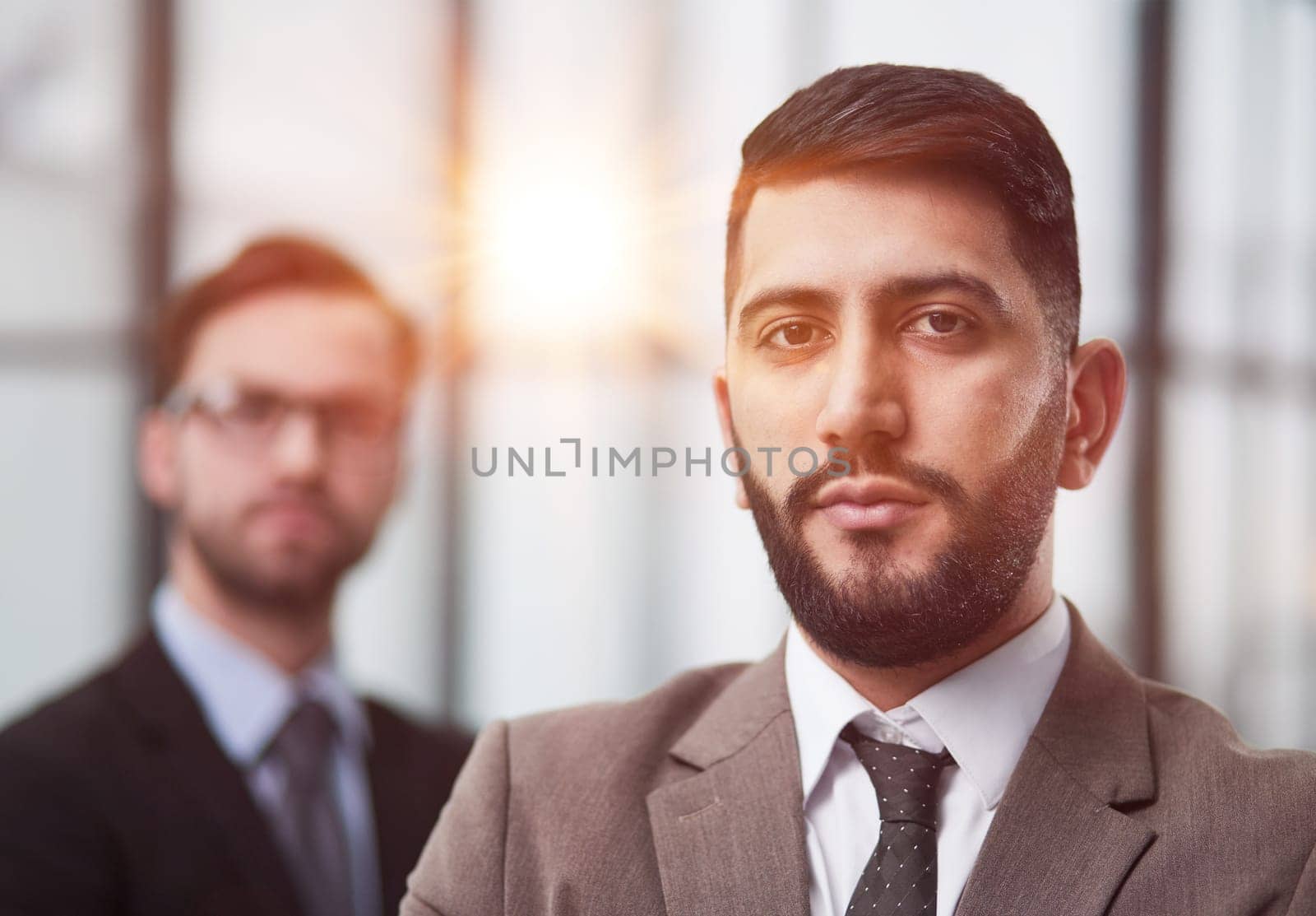 Portrait male worker looking at camera, positive employee posing for company business directory with co-workers by Prosto