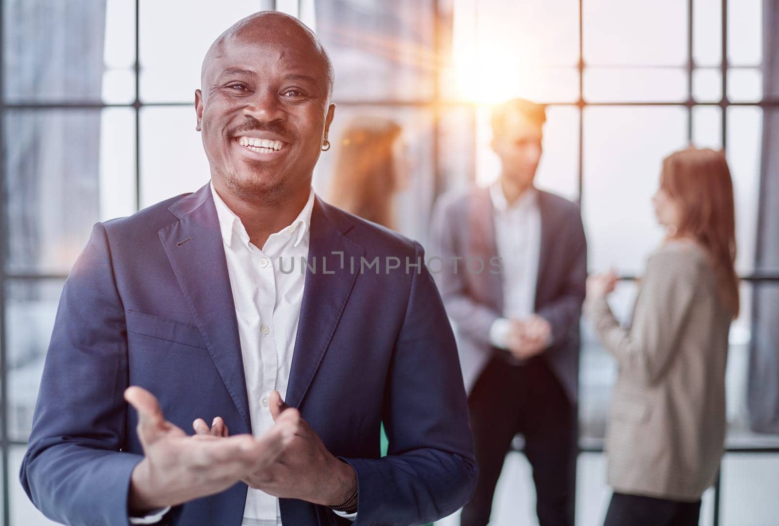 Handsome african american executive businessman in the office close up