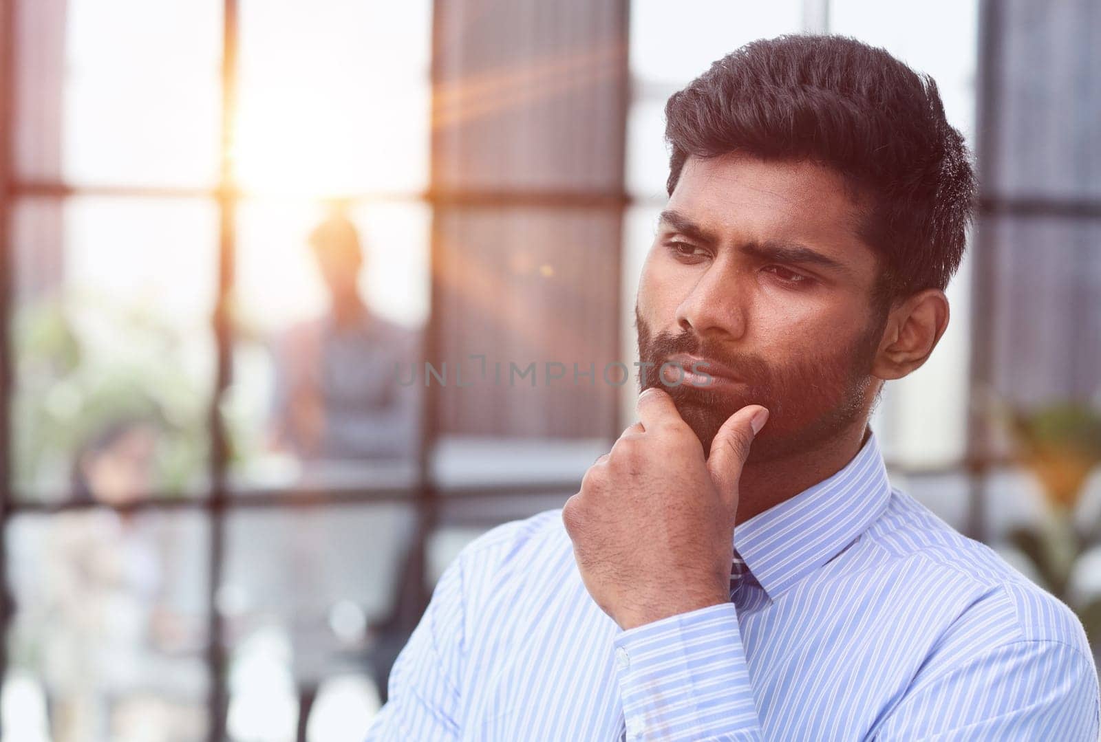 Thoughtful young handsome married bearded man in blue shirt by Prosto