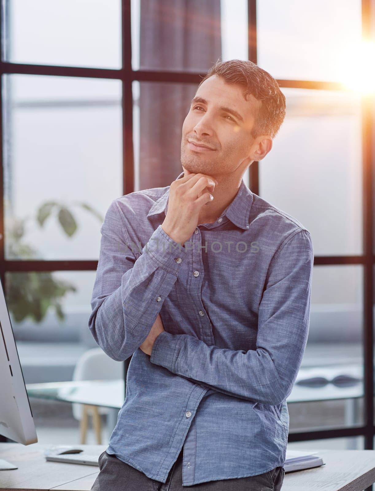 Serious thoughtful millennial business man looking away, thinking over creative ideas for project, making