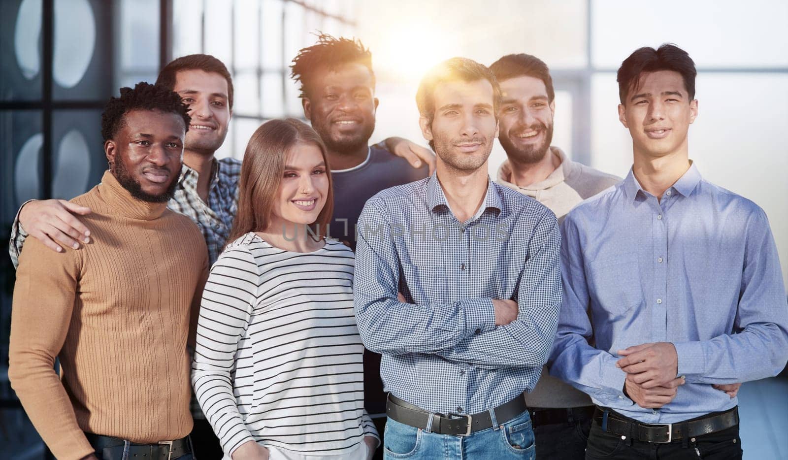 Everybody brings a different skill to the team. Portrait of a diverse group of coworkers standing in an office.