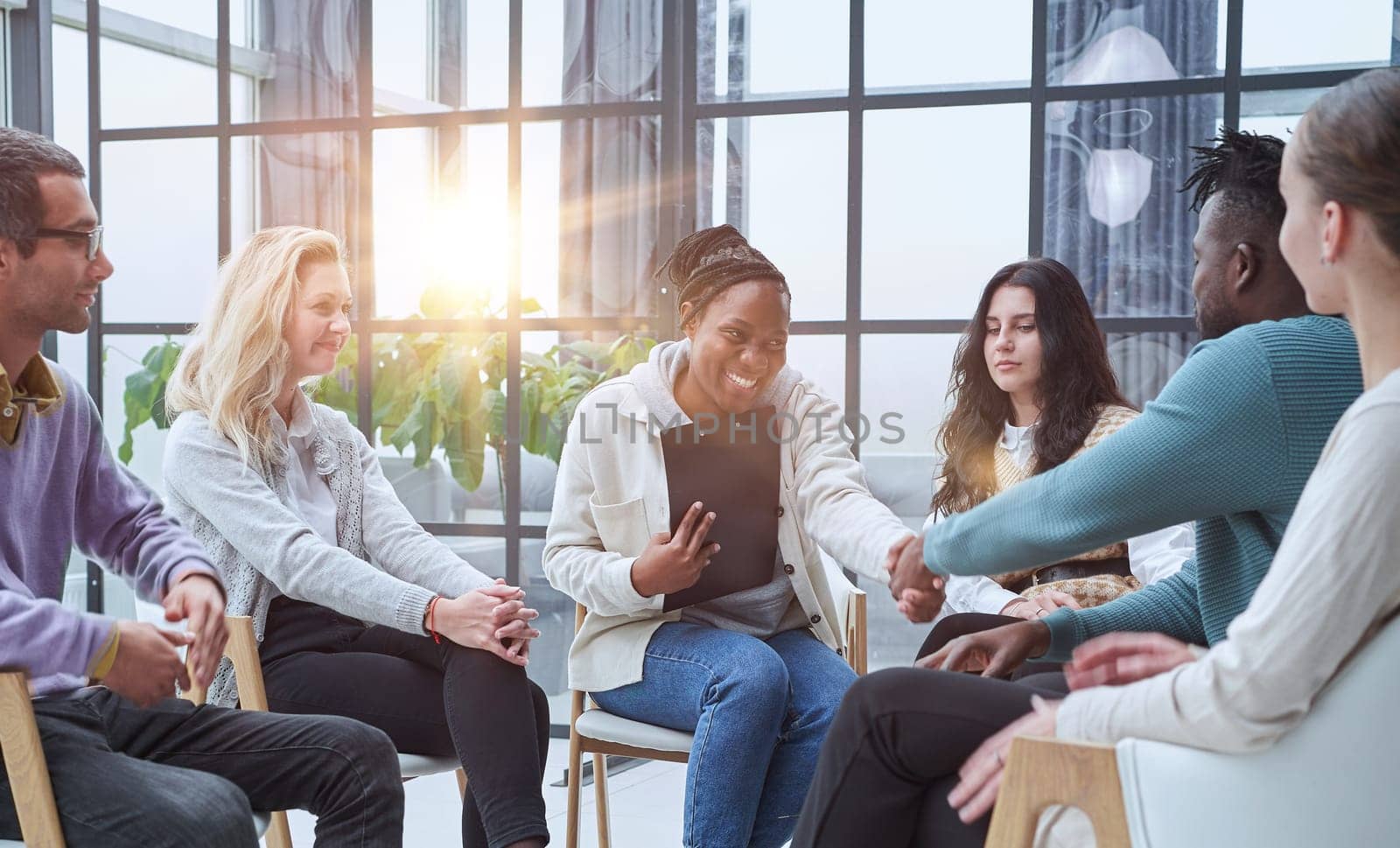 Photo of partners clapping hands after business seminar.