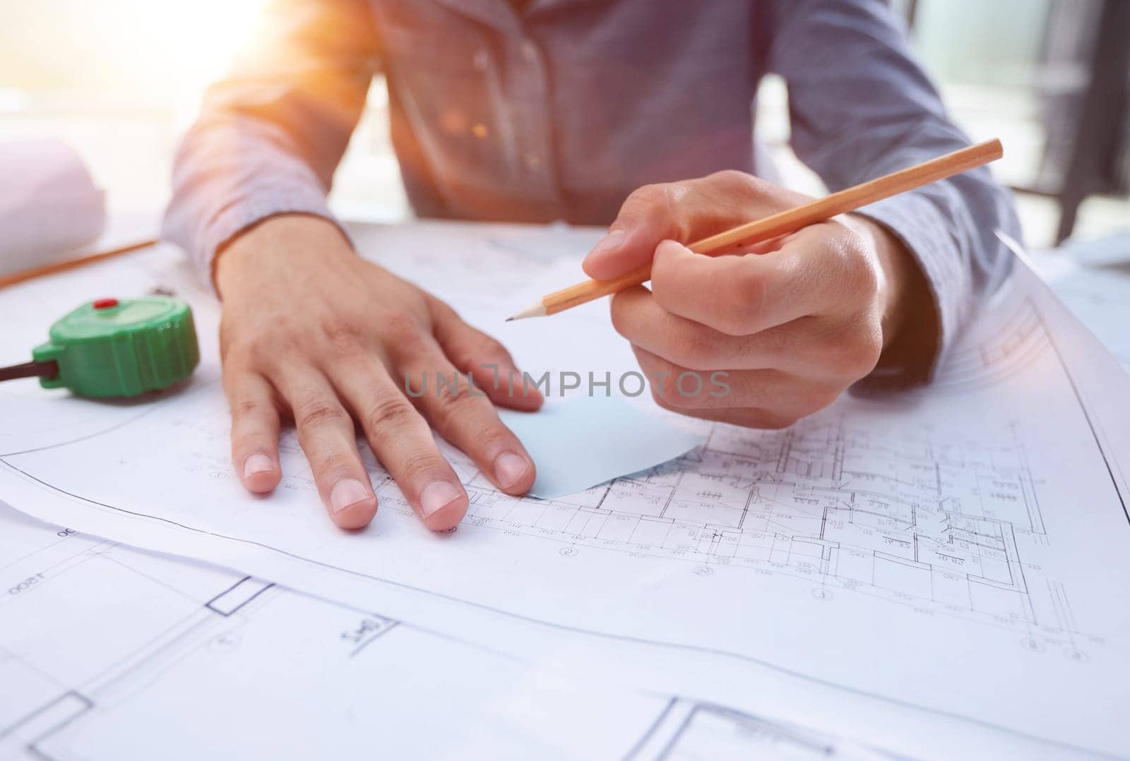 close-up of an architect looking at a house plan