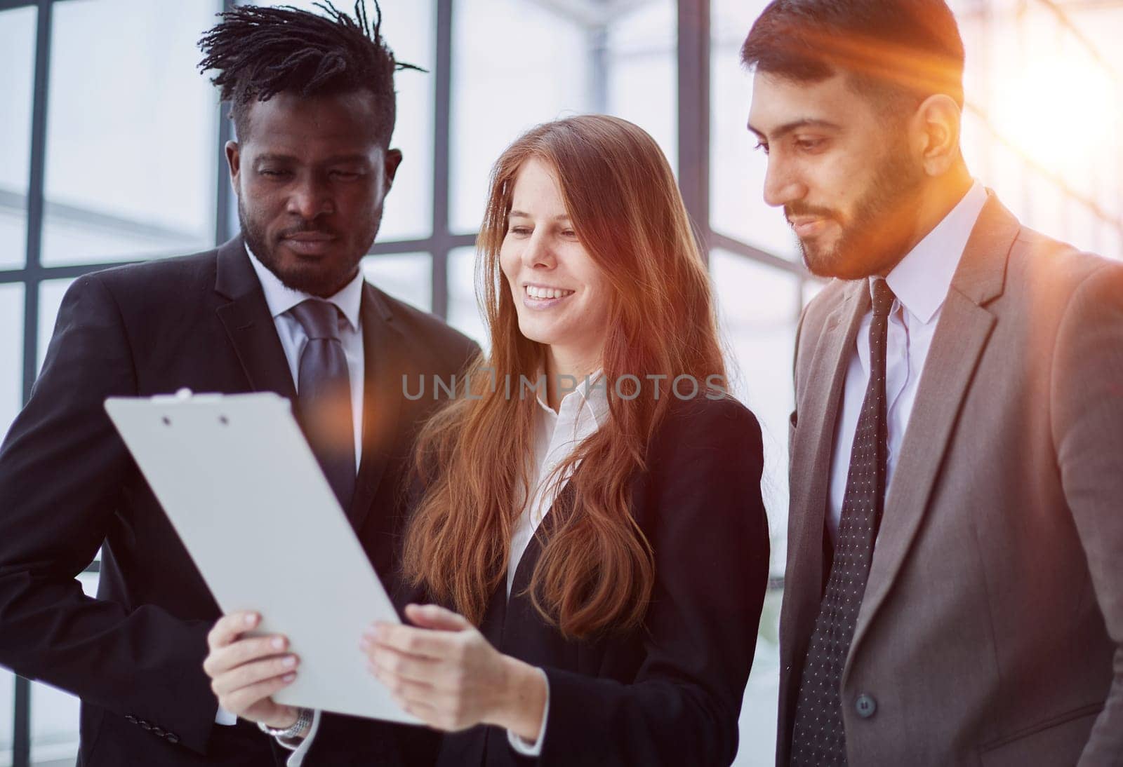 Young businesspeople working together at office corridor,