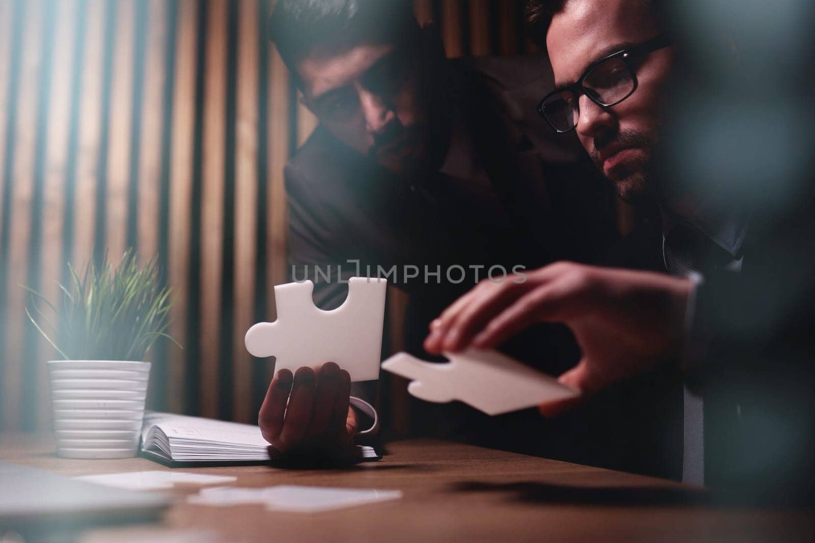 Business teamwork with white puzzle pieces cooperation