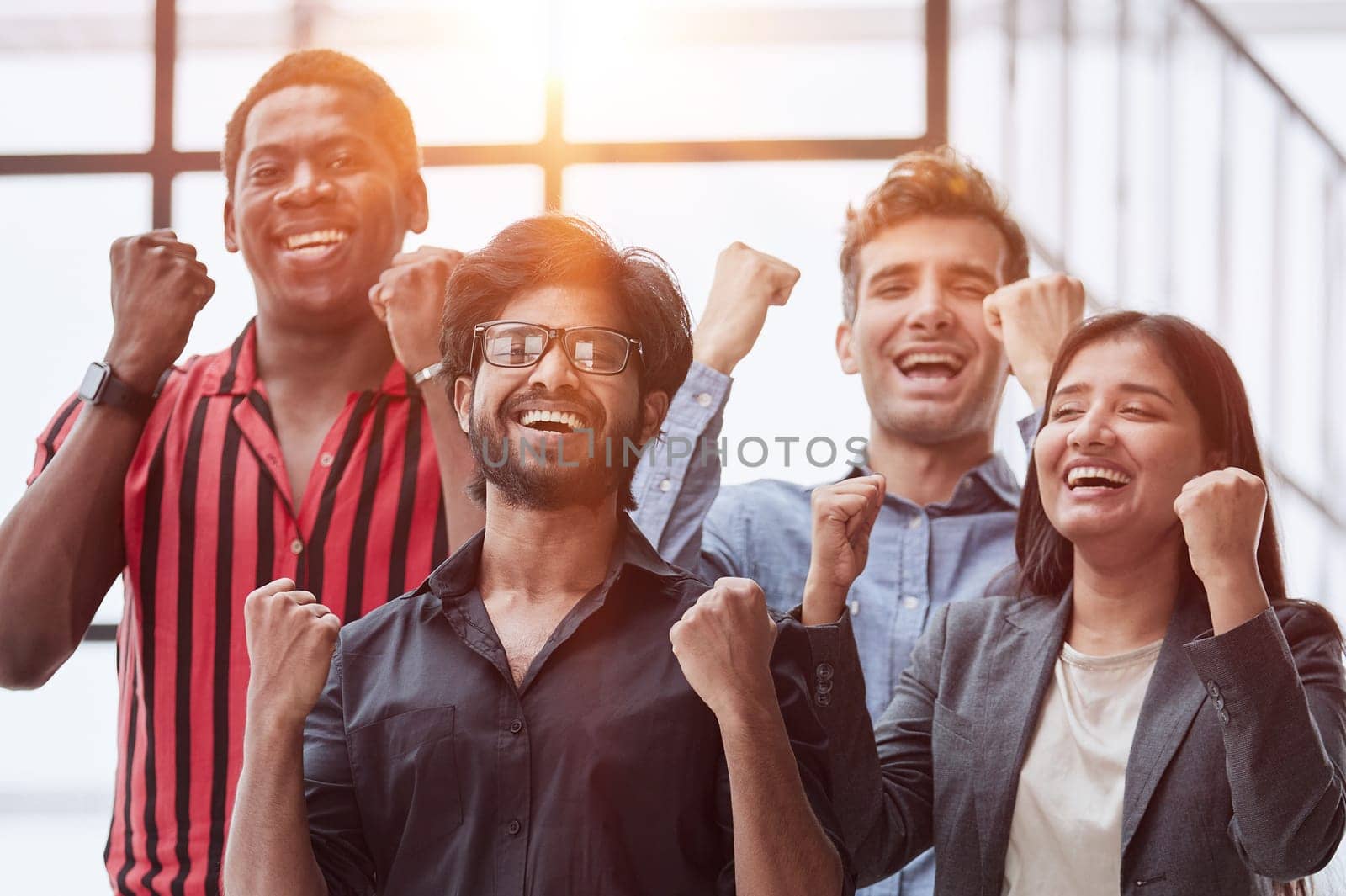 Happy businessmen raise their fists up and laugh. They have training