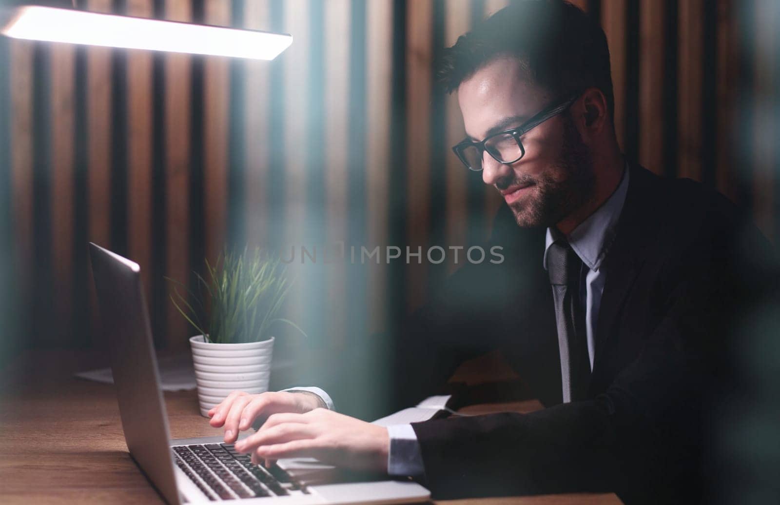 Portrait man, businessman, company founder, office worker sitting in the office