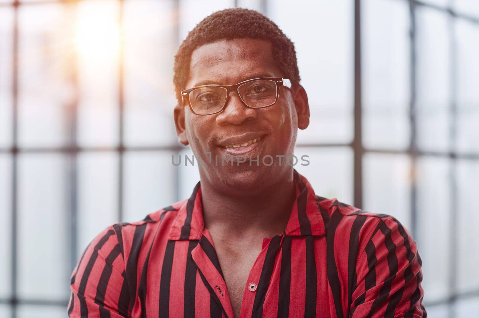 Portrait of african american businessman looking to camera in office