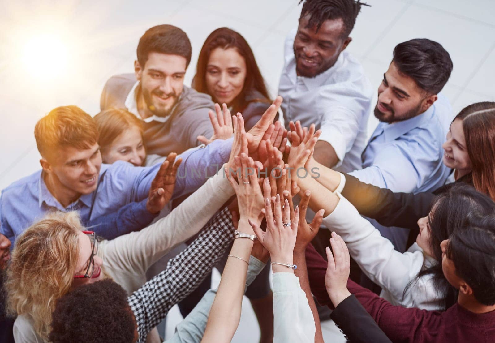 Narrow banner of multiracial people stack hands motivated for shared business success or goal achievement.