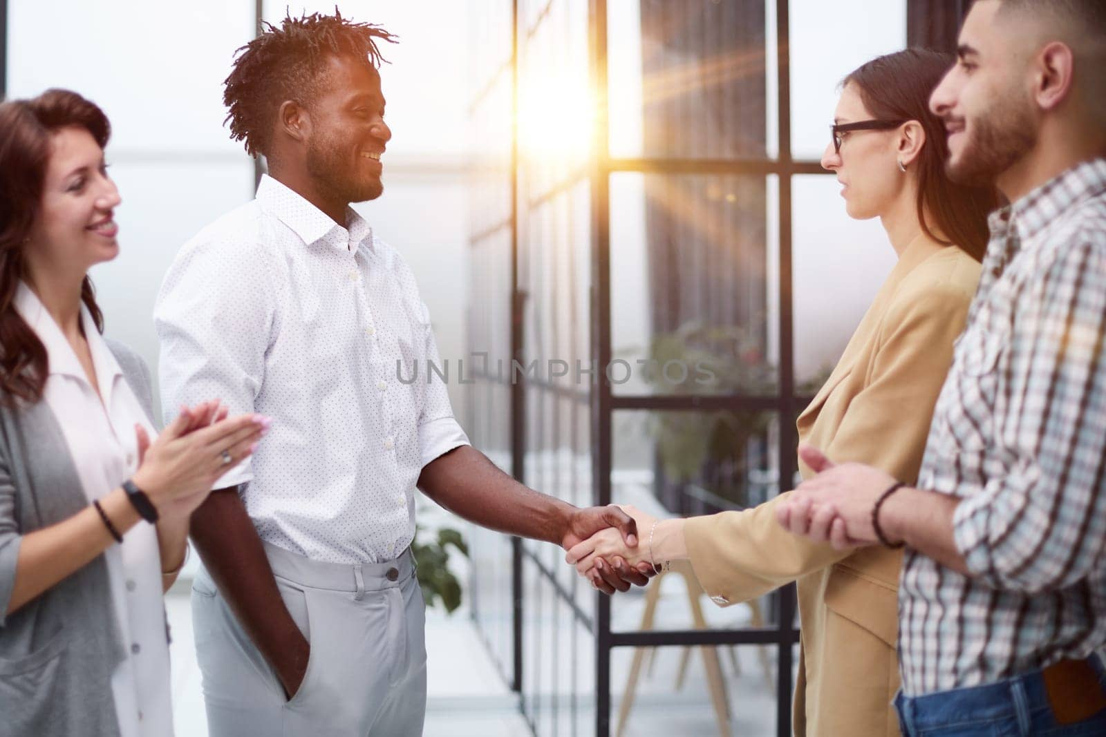 Confident business partners meet in an office building and talk