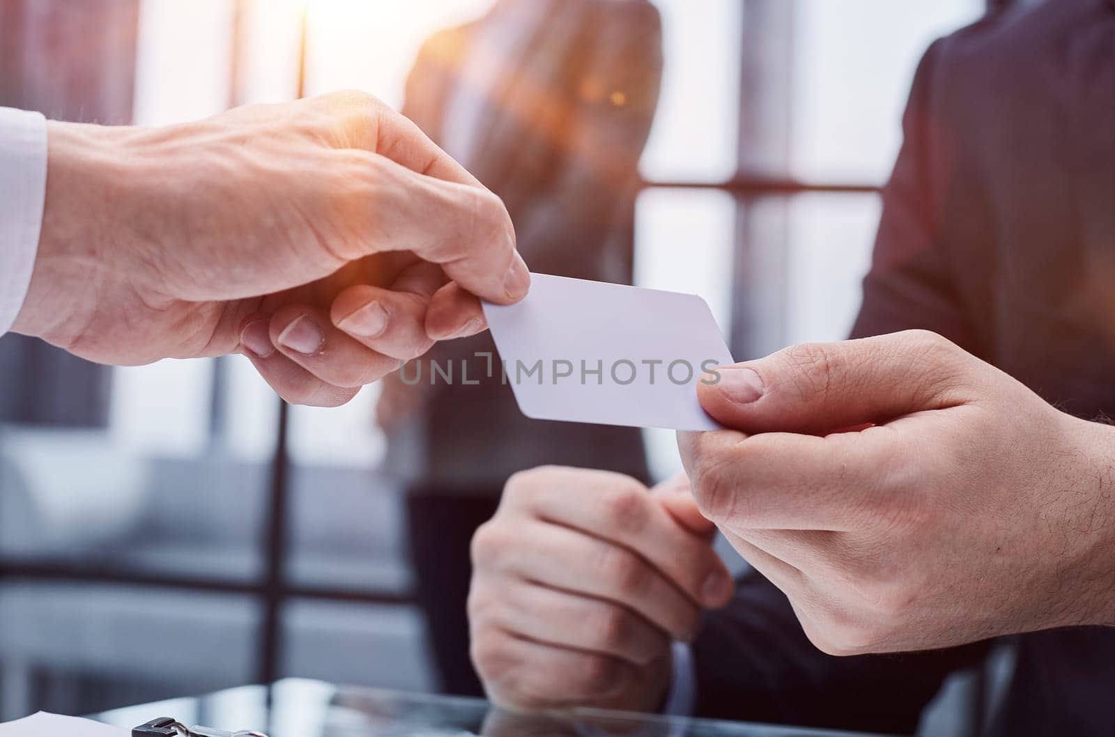 Close up of male employee stretch hand suggest give white mockup blank empty business card to client by Prosto