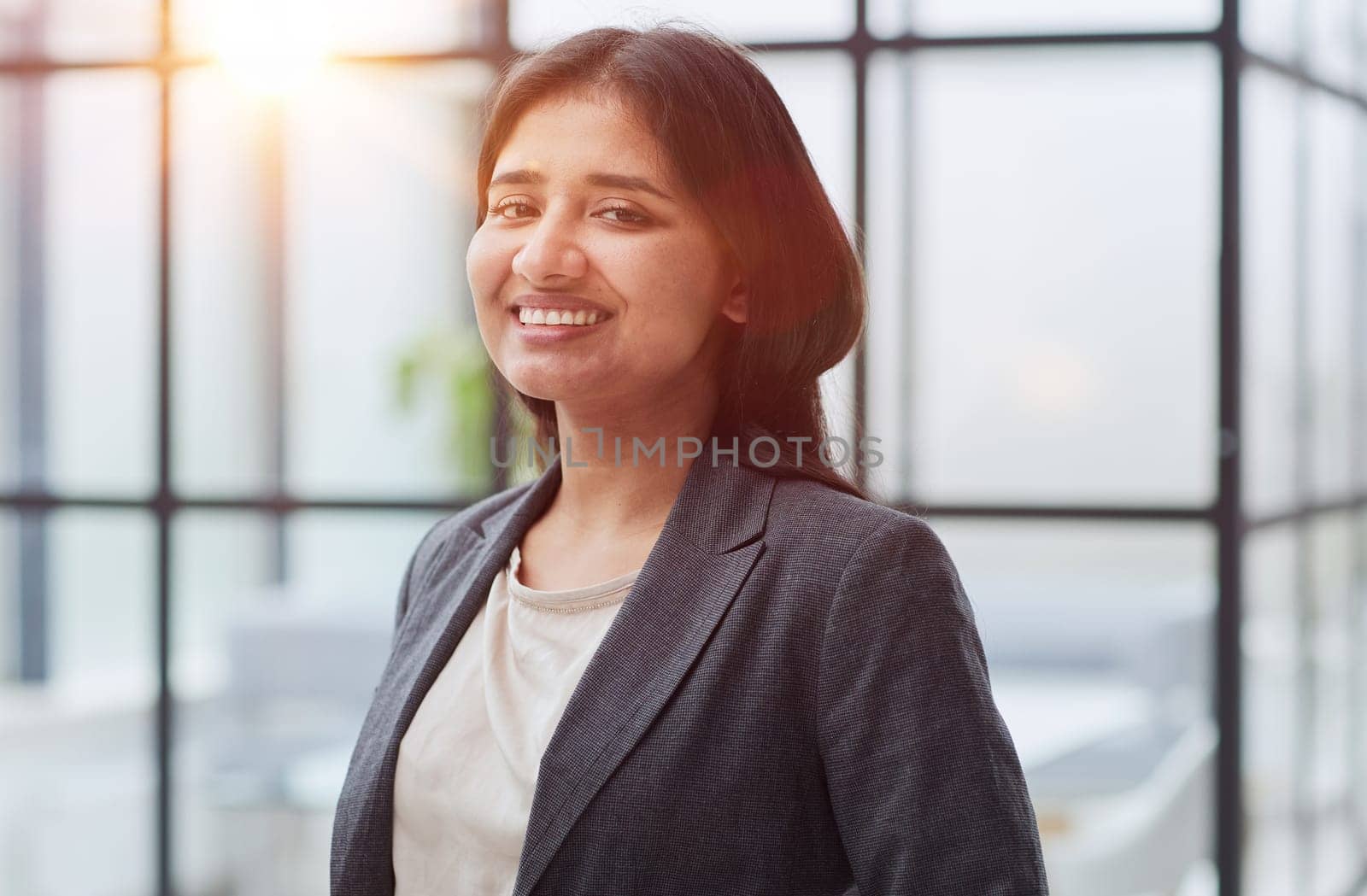 Young confident caucasian serious pretty business woman in office clothes