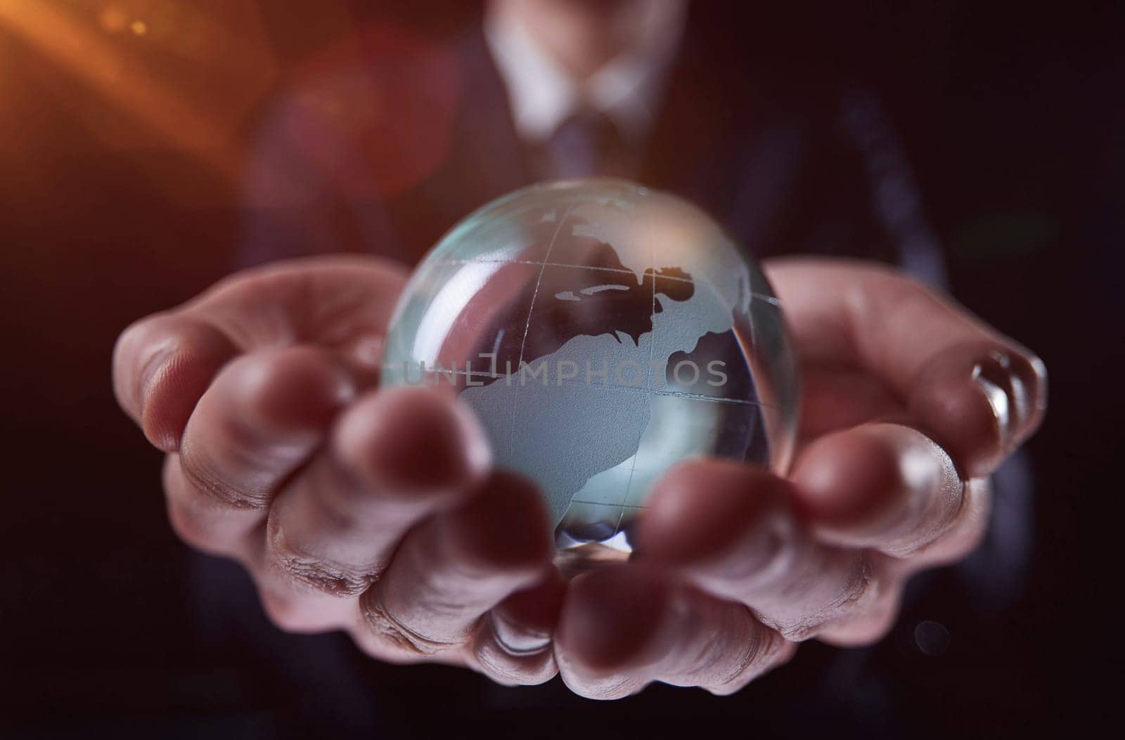 a person holding a small glass globe in their hands, generative AI