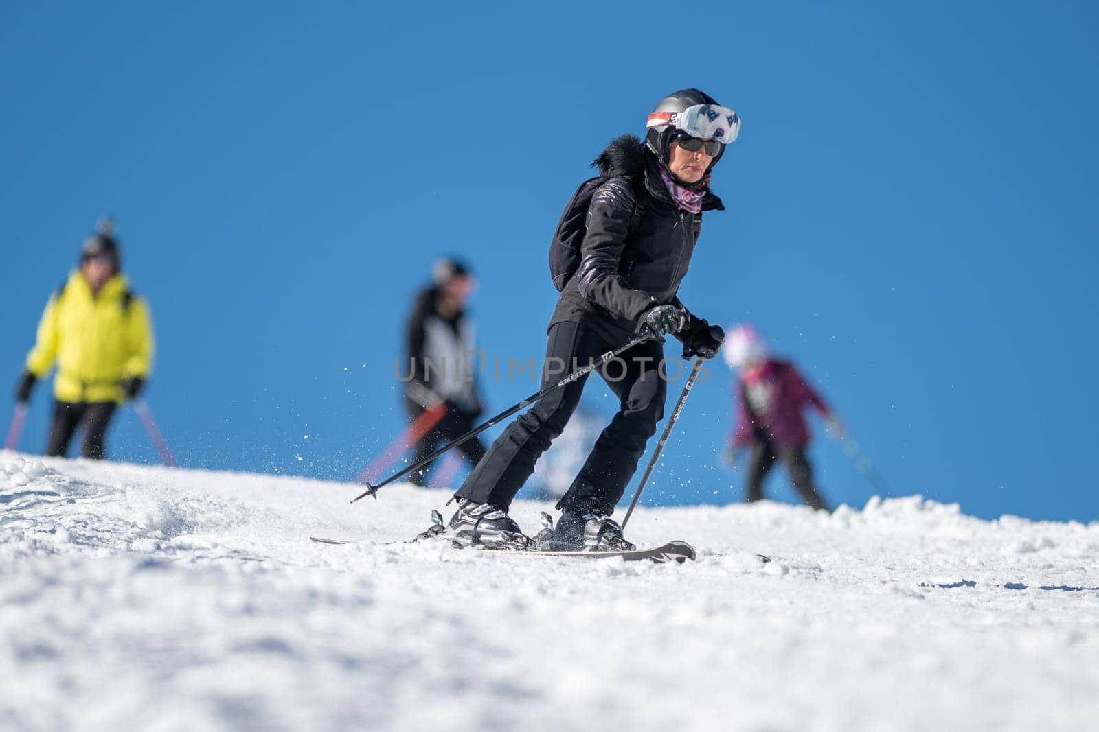 Woman skiing on the slopes of Grandvalira in Andorra in the winter of 2024. by martinscphoto