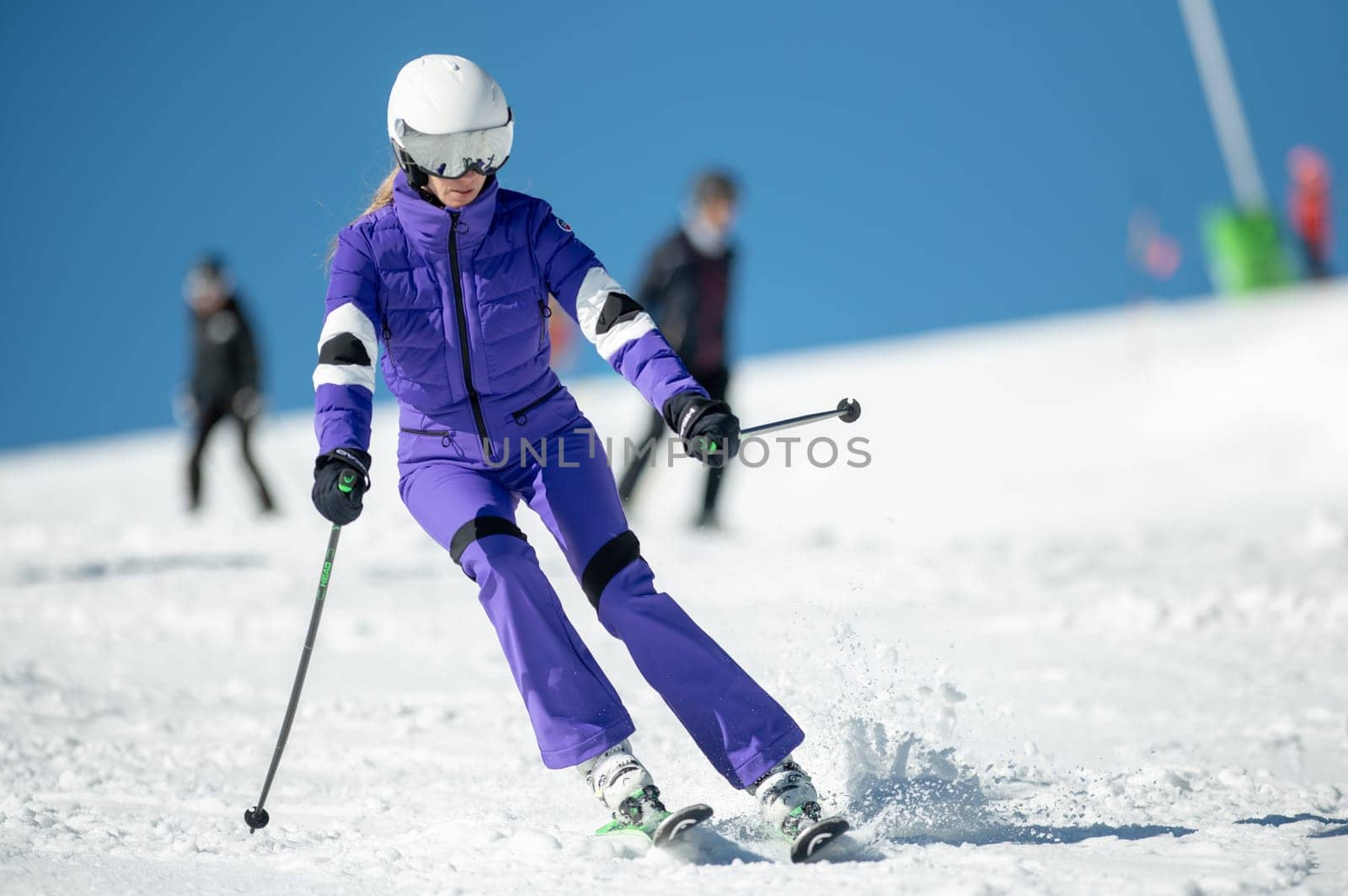 Woman skiing on the slopes of Grandvalira in Andorra in the winter of 2024. by martinscphoto