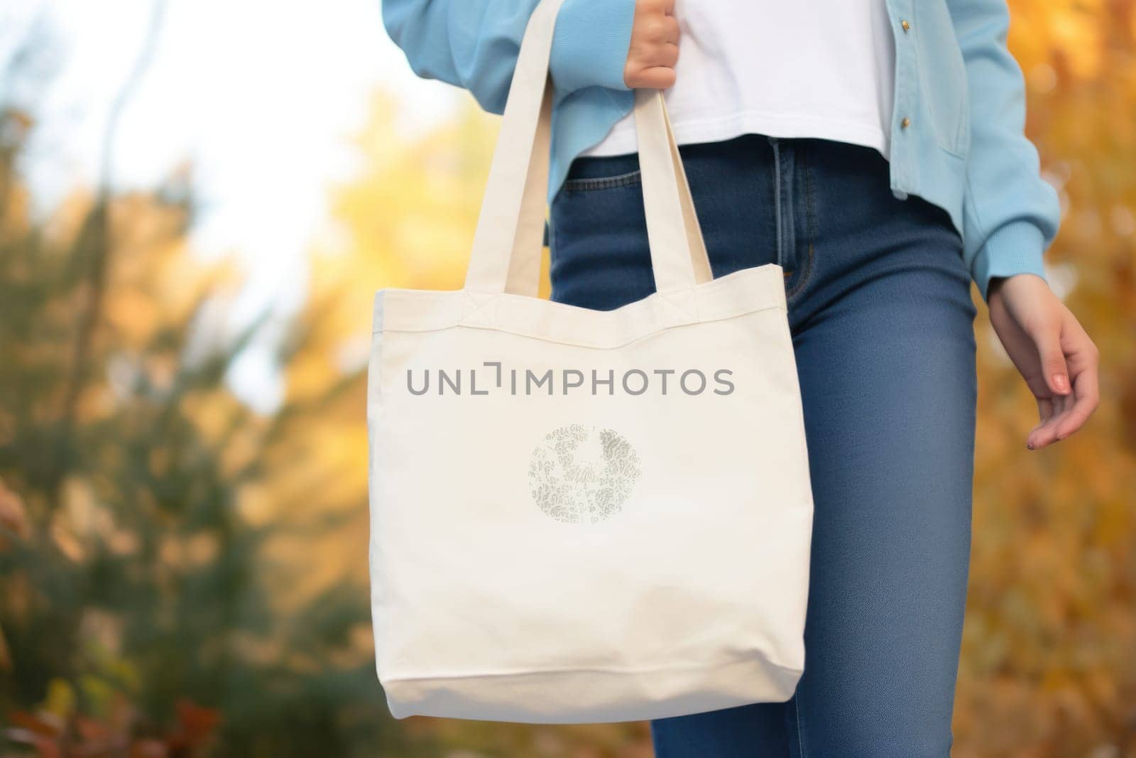 Model hold blank white fabric mockup bag for save environment on street fashion by nijieimu