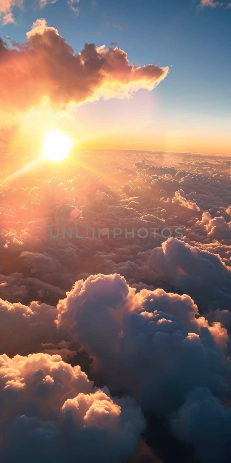 An aerial perspective of a breathtaking sunrise illuminating the fluffy texture of clouds from above.