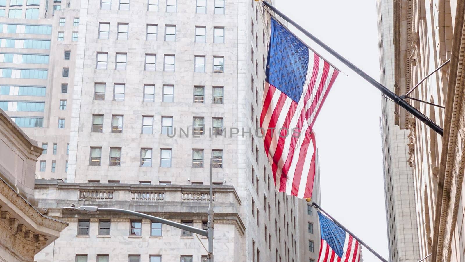 American flags on the main facade of the New York Stock Exchange - NYSE Building in the Financial District of Lower Manhattan in New York City is seen on July 4th, 2023.