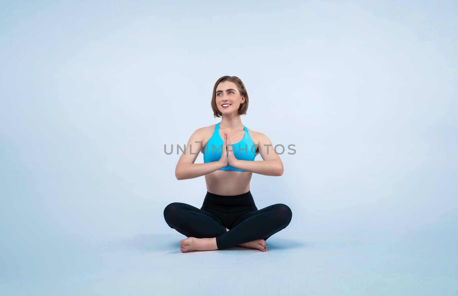 Full body length gaiety shot athletic and sporty woman doing healthy and meditative yoga exercise workout posture on isolated background. Healthy active and body care lifestyle