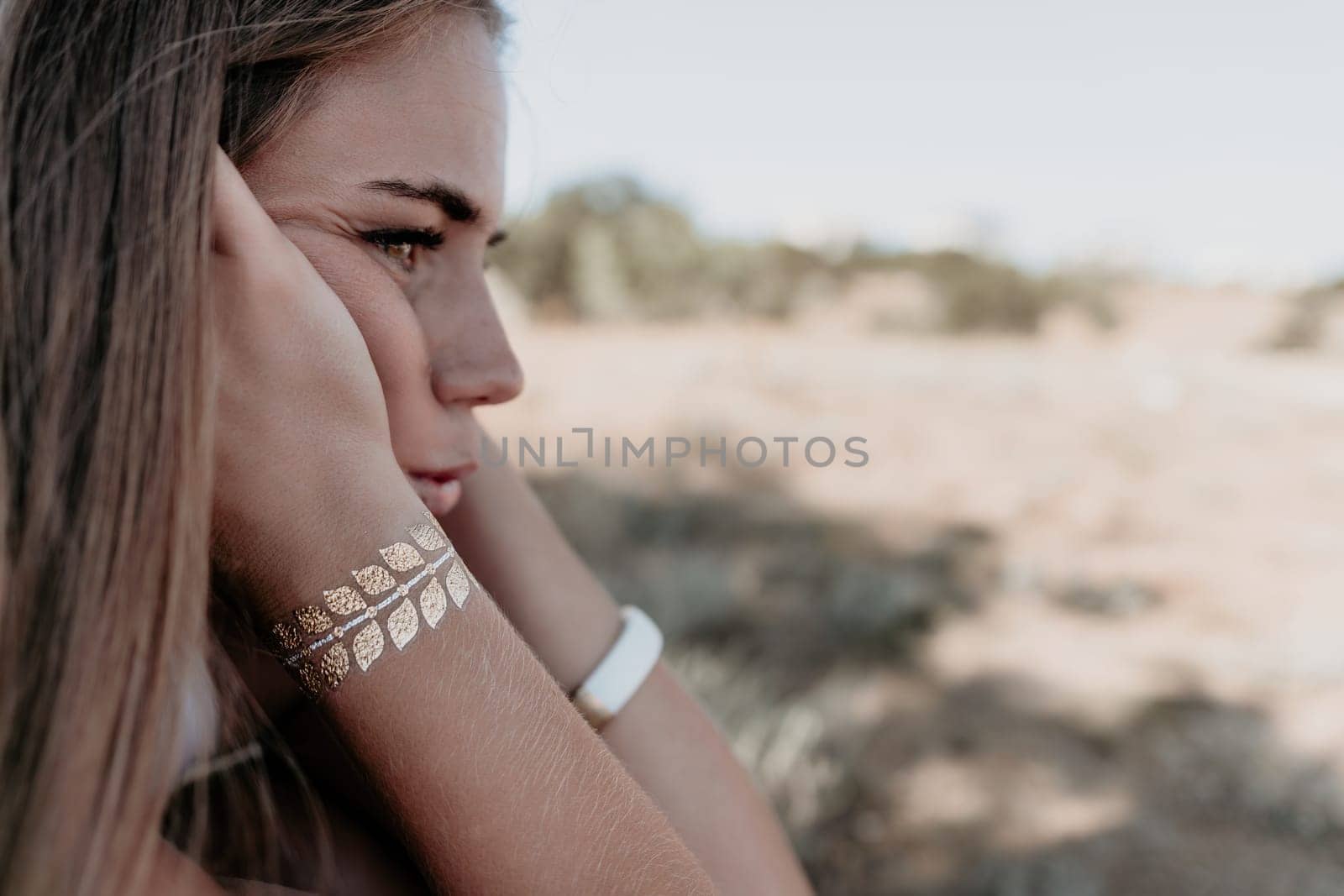 Woman summer travel sea. Happy tourist in hat enjoy taking picture outdoors for memories. Woman traveler posing on the beach at sea surrounded by volcanic mountains, sharing travel adventure journey by panophotograph