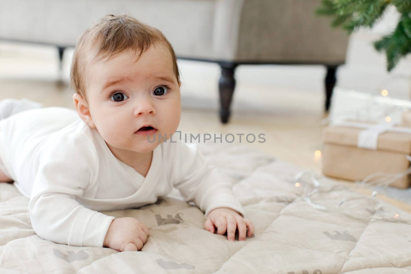 Cute child lying on bed in living room by Demkat