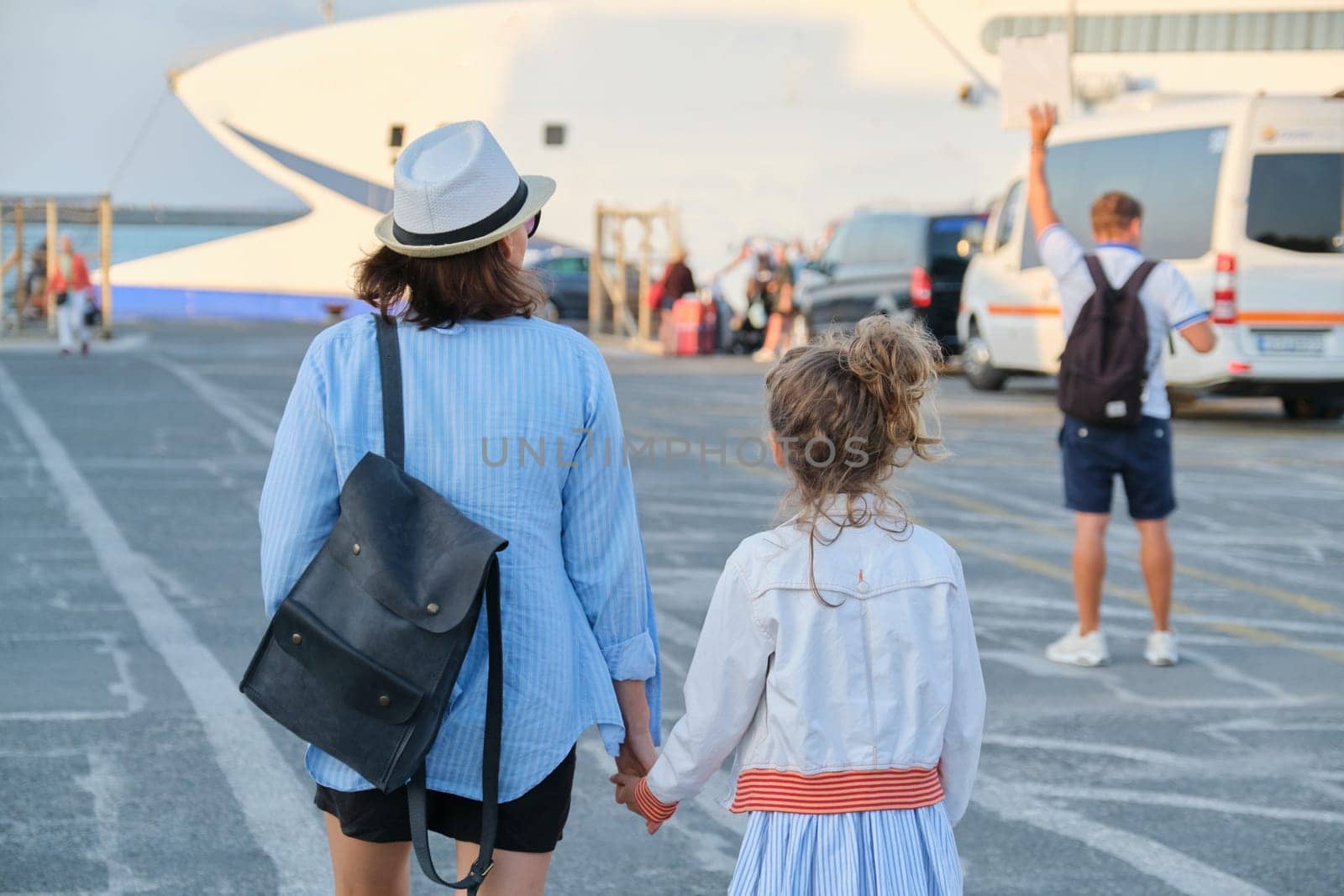 Sea transport, Mediterranean sea port, traveling family mother and little daughter walking together holding hand