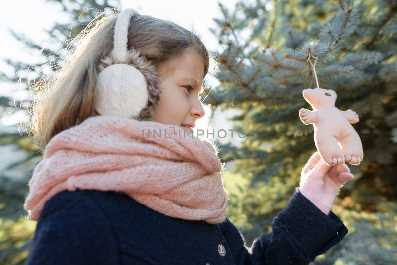 Winter outdoor portrait of child girl near the Christmas tree by VH-studio