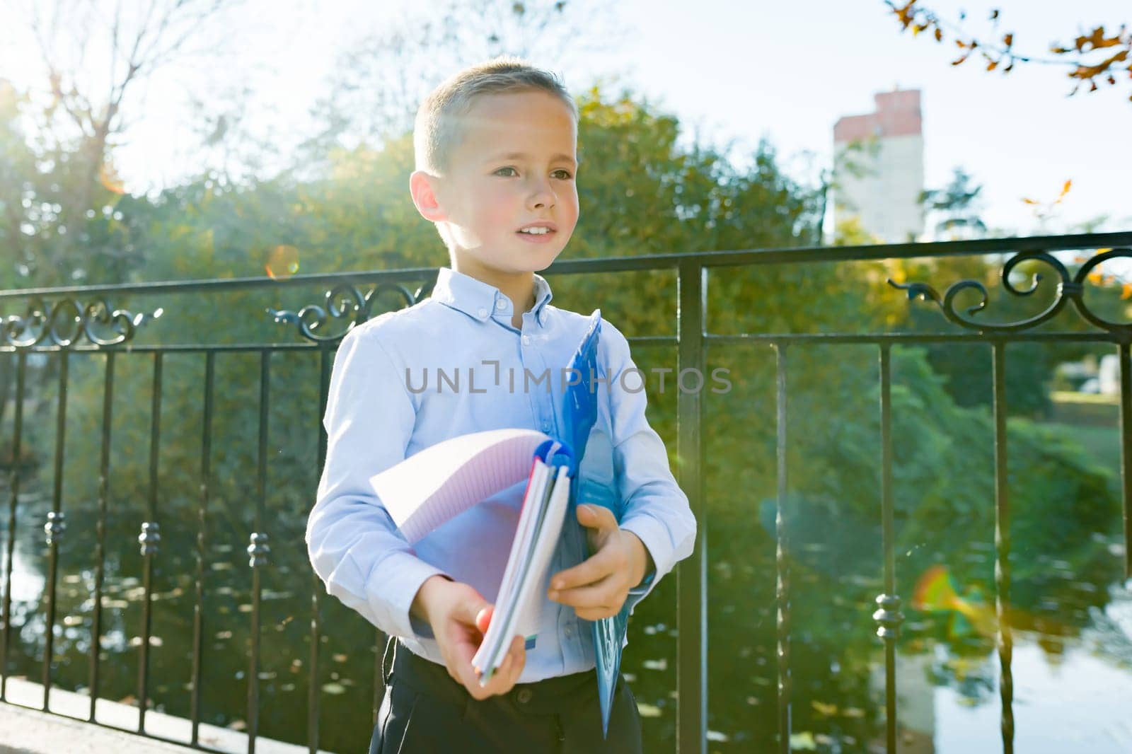 Back to school, portrait of boy with backpack, school supplies by VH-studio