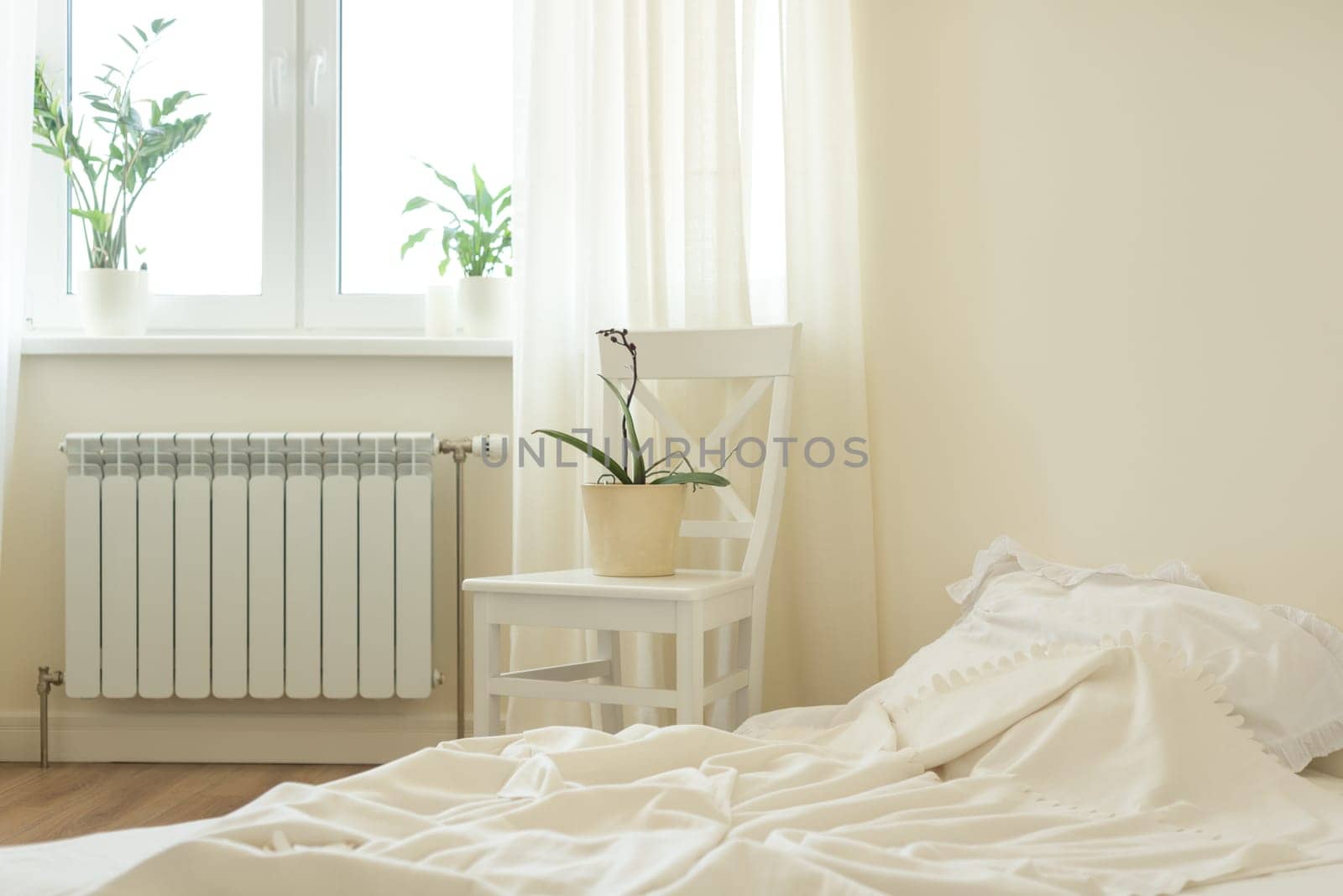 Light pastel bedroom interior, bed, white chair, window light curtains