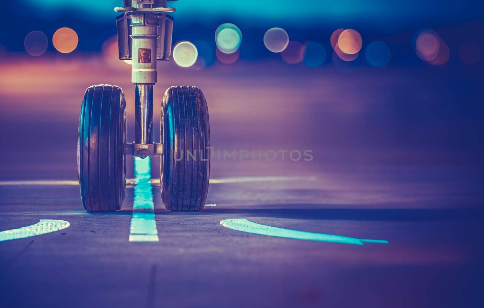 Airplane Wheels On The Runway At Sunset by mrdoomits