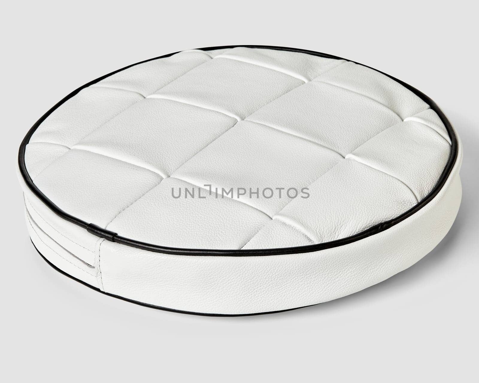 Round cushion in white patchwork leather with contrasting black trim by nazarovsergey