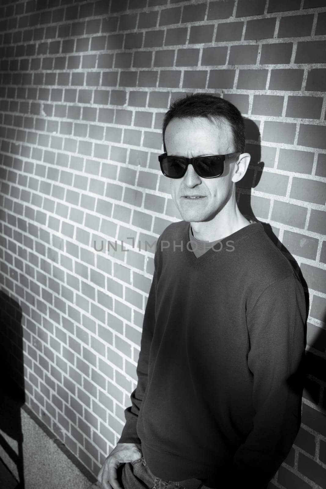 Jovial man in positive and calm attitude. Outside