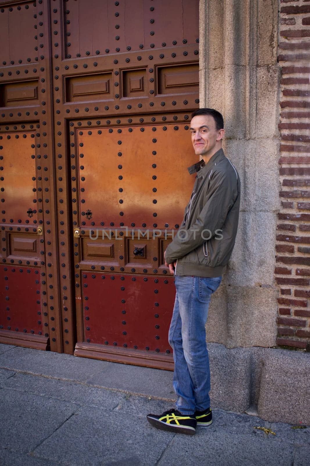 Jovial man in positive and calm attitude. Outside