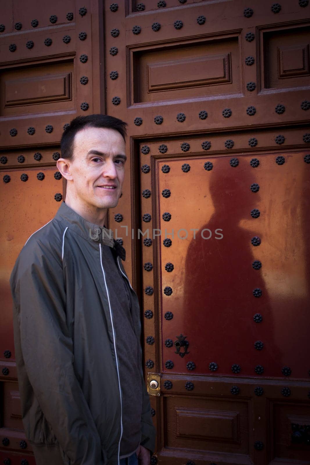 Jovial man in positive and calm attitude. Outside