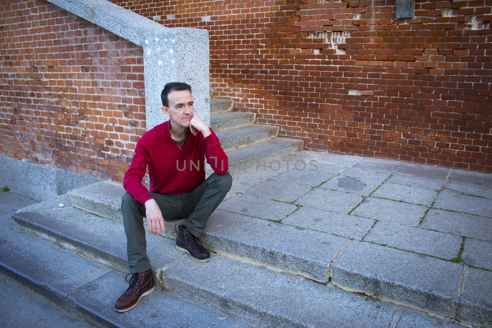 Jovial man in positive and calm attitude. Outside