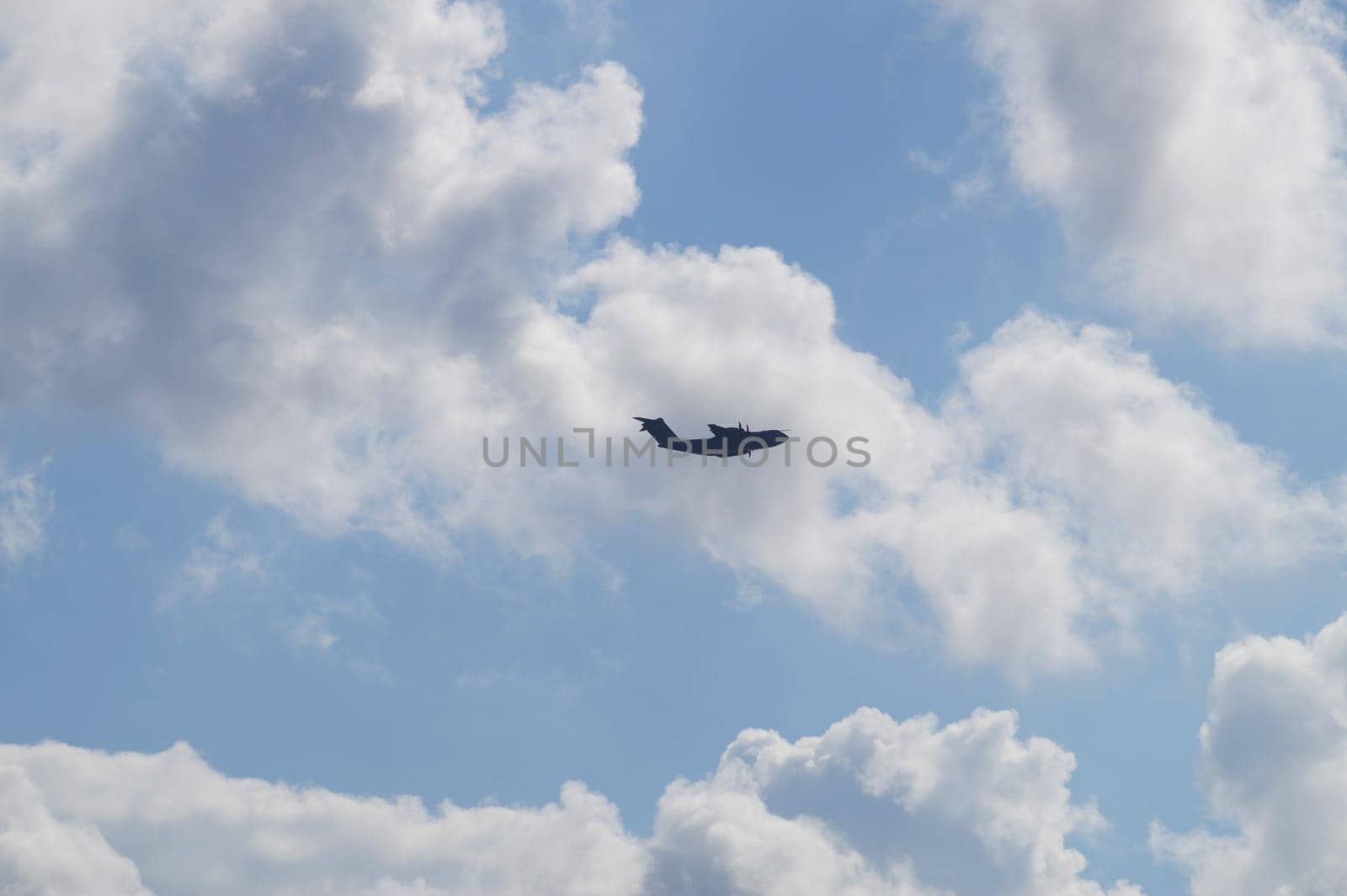 small plane in the cloudy sky, copy space