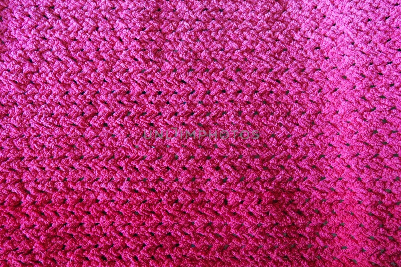 Textures of this close-up of a pink crocheted blanket. by darksoul72