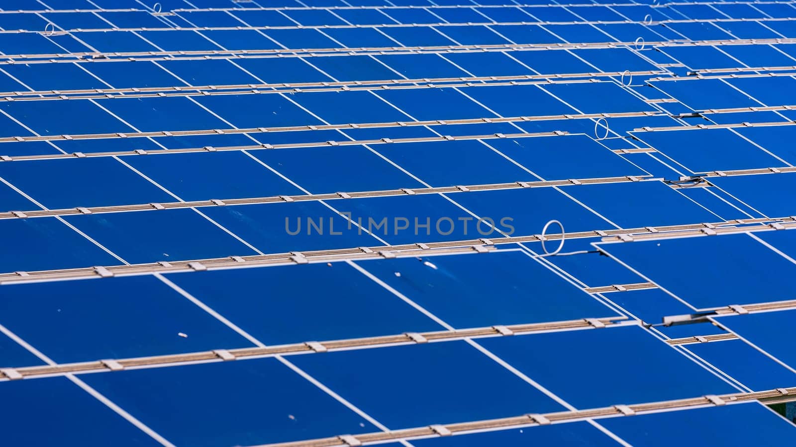 Solar panels from a solar field to generate renewable energy with sunshine up to the horizon