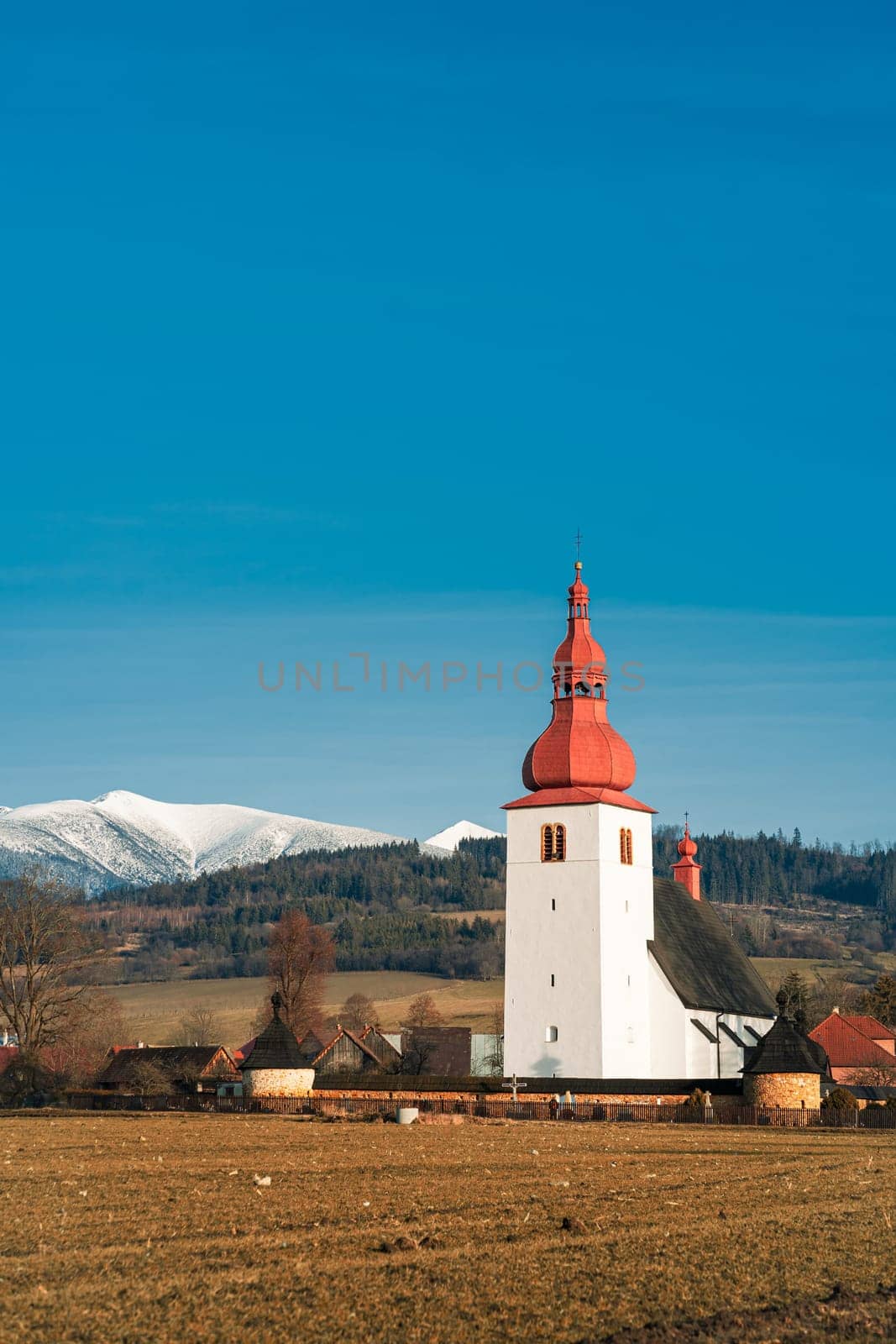 Amazing small church and houses in Demanovska Dolina village, Low Tatras mountains, Slovakia