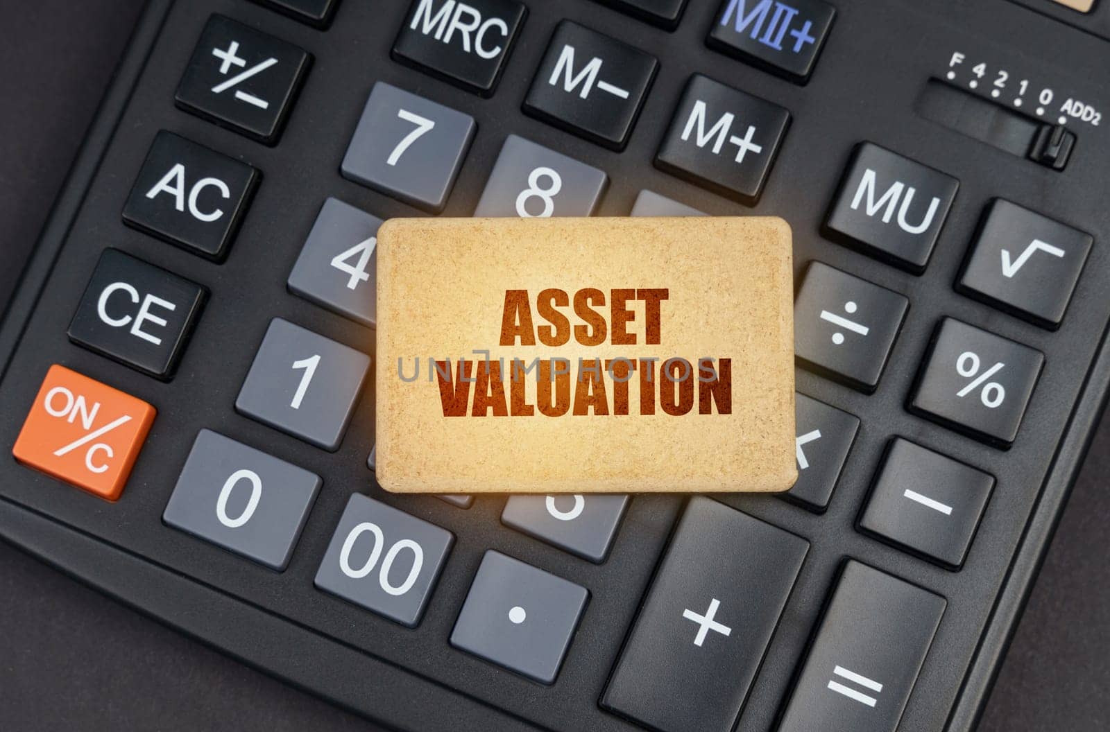 Financial concept. There is a sign on the calculator that says - Asset valuation