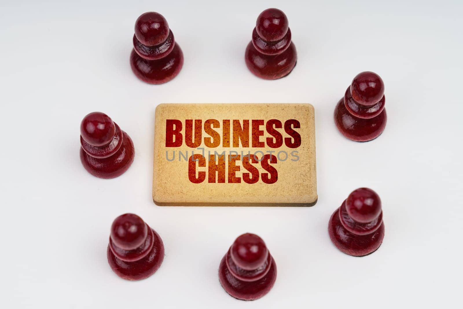 On a white background, pawns stand around a sign with the inscription - Business Chess by Sd28DimoN_1976