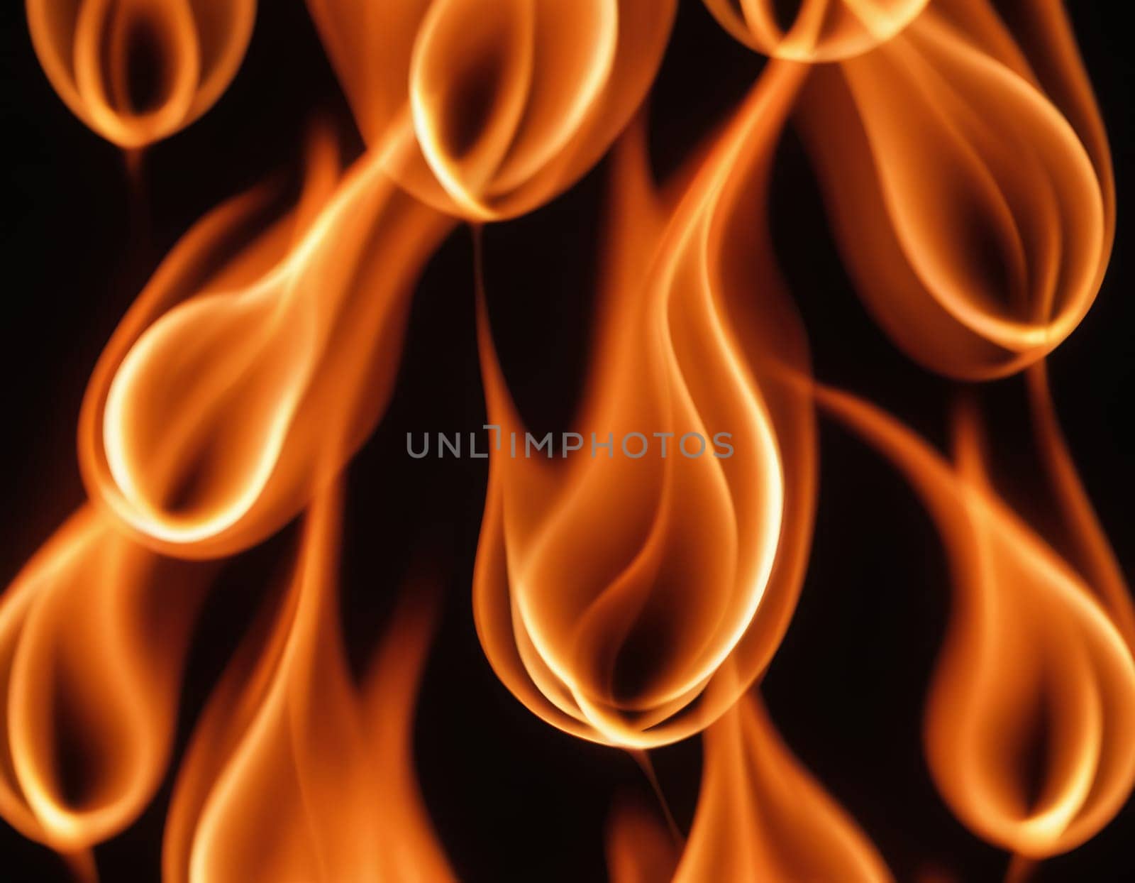 A close-up view of dynamic and intense flames in various shades of orange, yellow, and red, creating a contrast with the dark background and conveying a sense of heat and energy