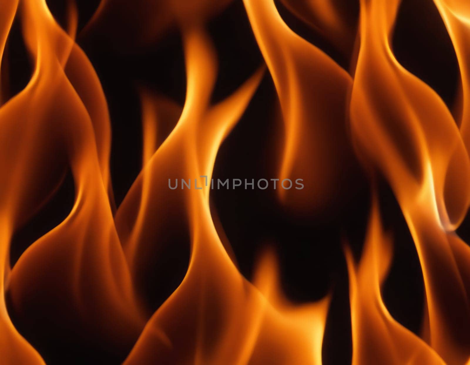 A close-up view of dynamic and intense flames in various shades of orange, yellow, and red, creating a contrast with the dark background and conveying a sense of heat and energy