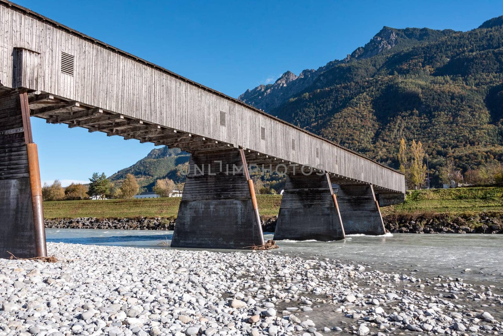The historic old Rhine bridge between Liechtenstein and Switzerland by imagoDens
