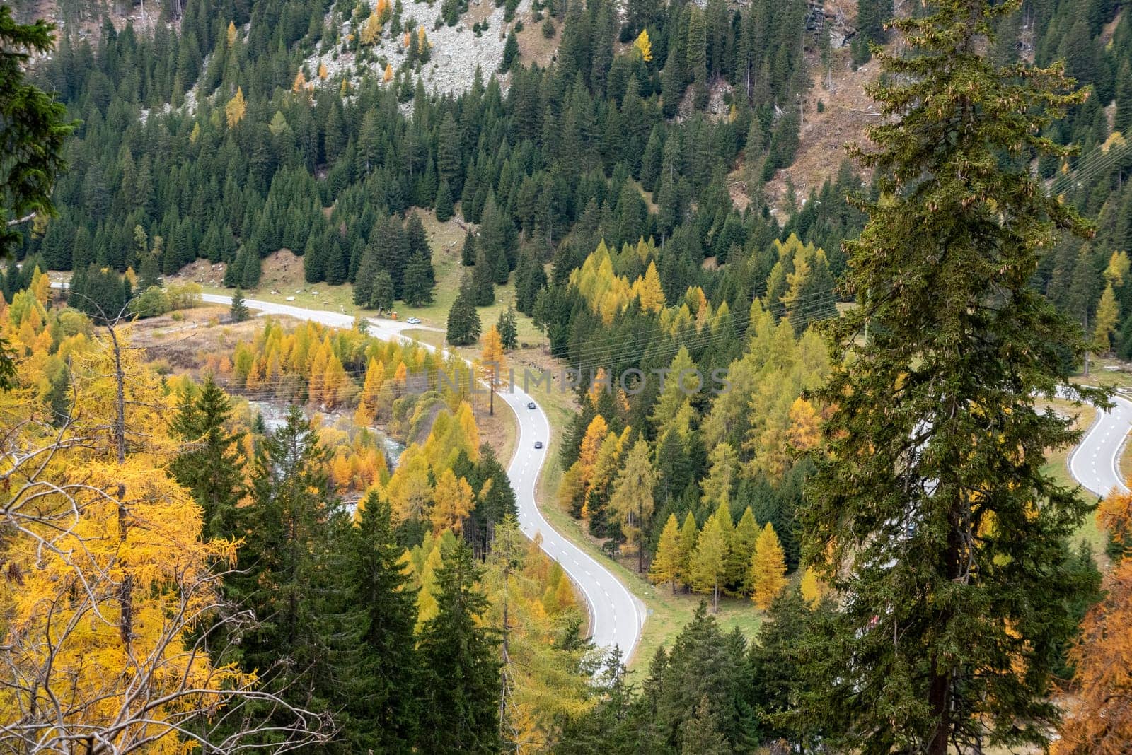 Scenic winding road at Maloja pass in Switzerland in autumn