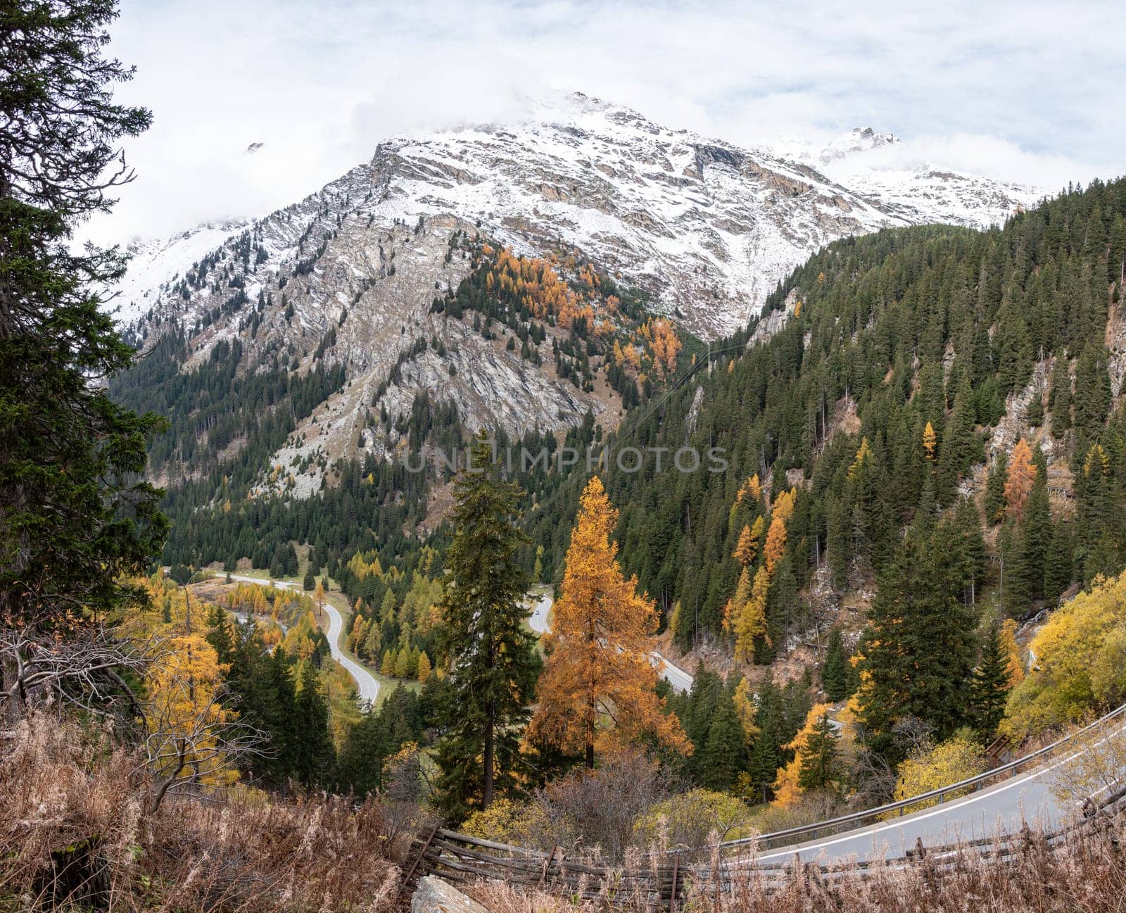 Scenic winding road at Maloja pass in Switzerland in autumn