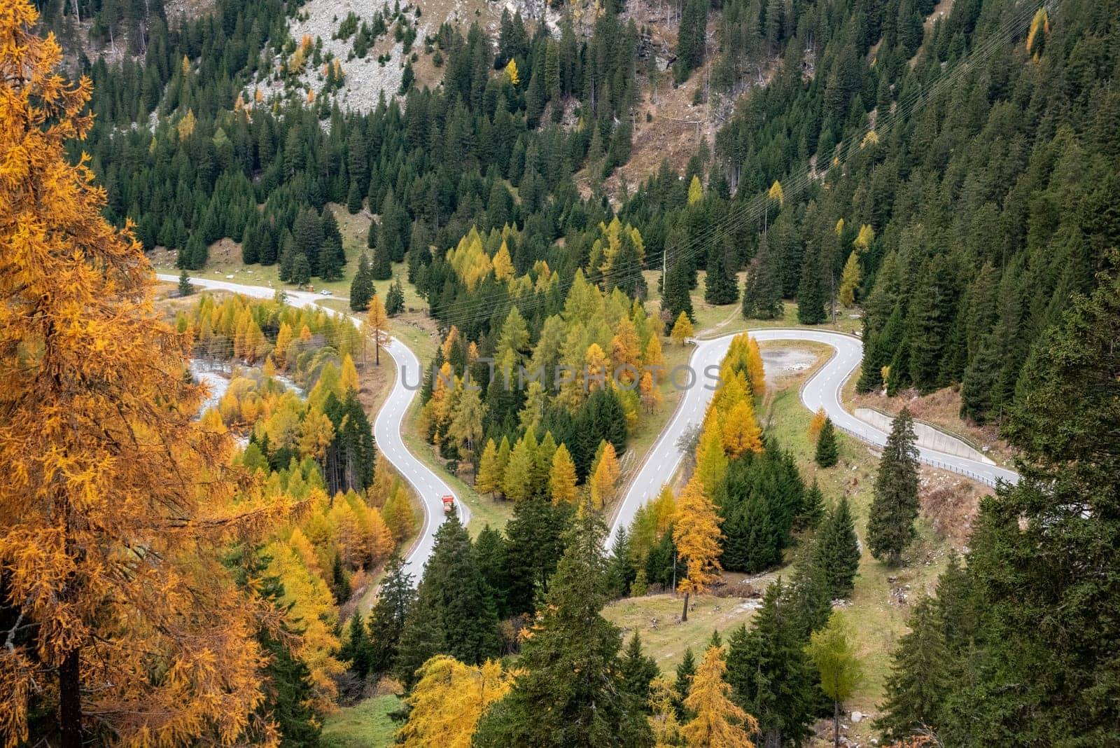Scenic winding road at Maloja pass in Switzerland in autumn