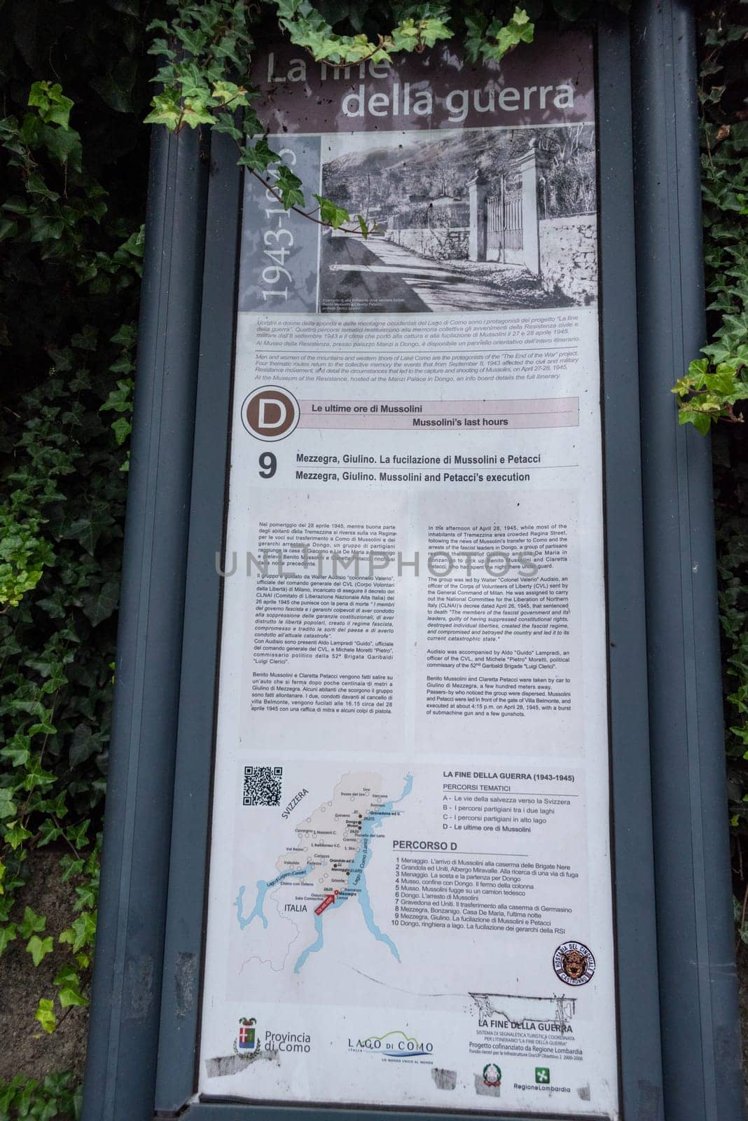 TREMEZZO, ITALY - OCTOBER 05, 2023 - Information board at the place of Mussolinis execution in Tremezzo at lake Como by imagoDens